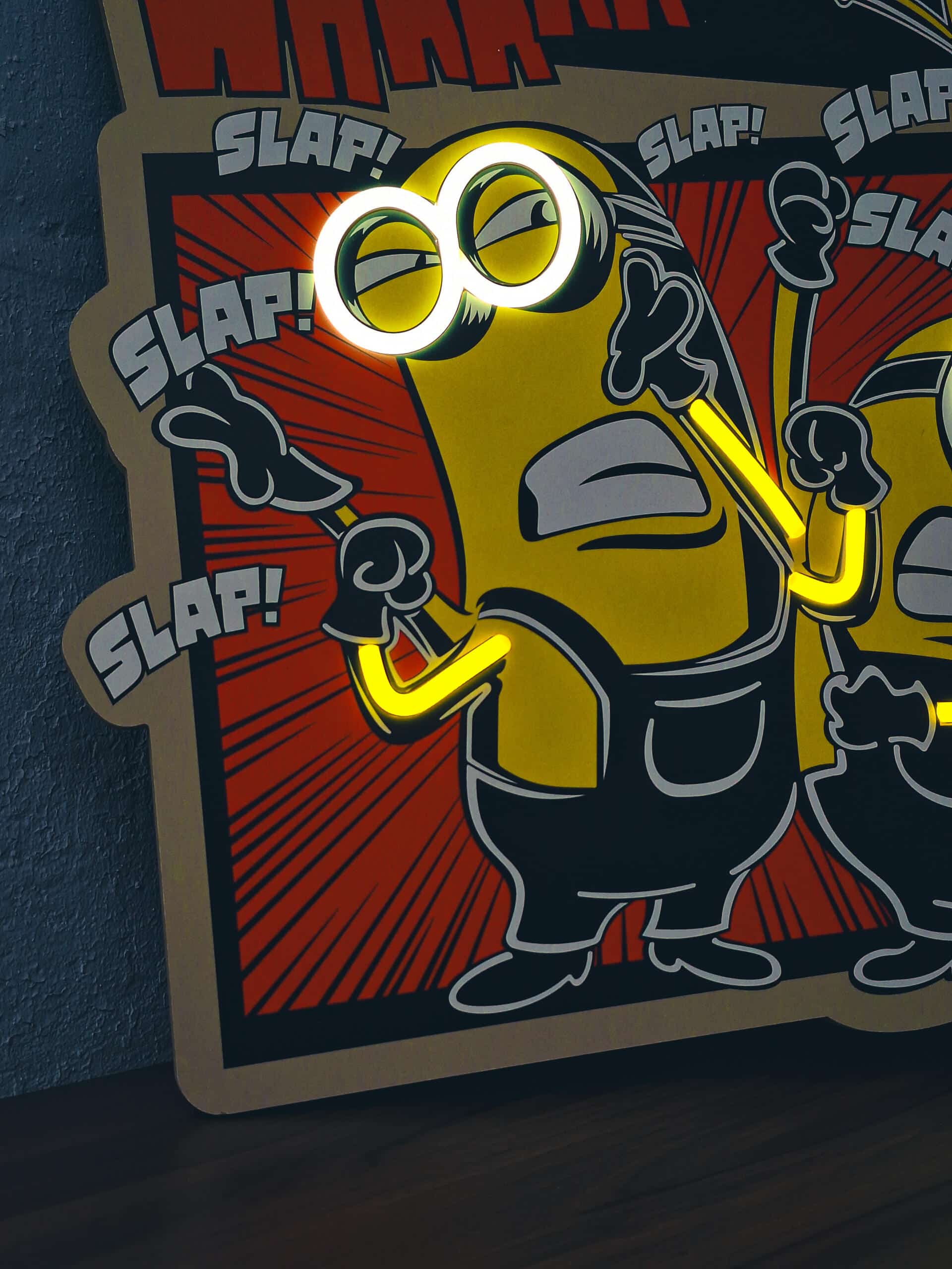 Exclusive Minions Comic LED Wall Art - Transform your space with this playful animated wall decor featuring the iconic yellow characters in comic strip style. Perfect for animation fans and kids' rooms!