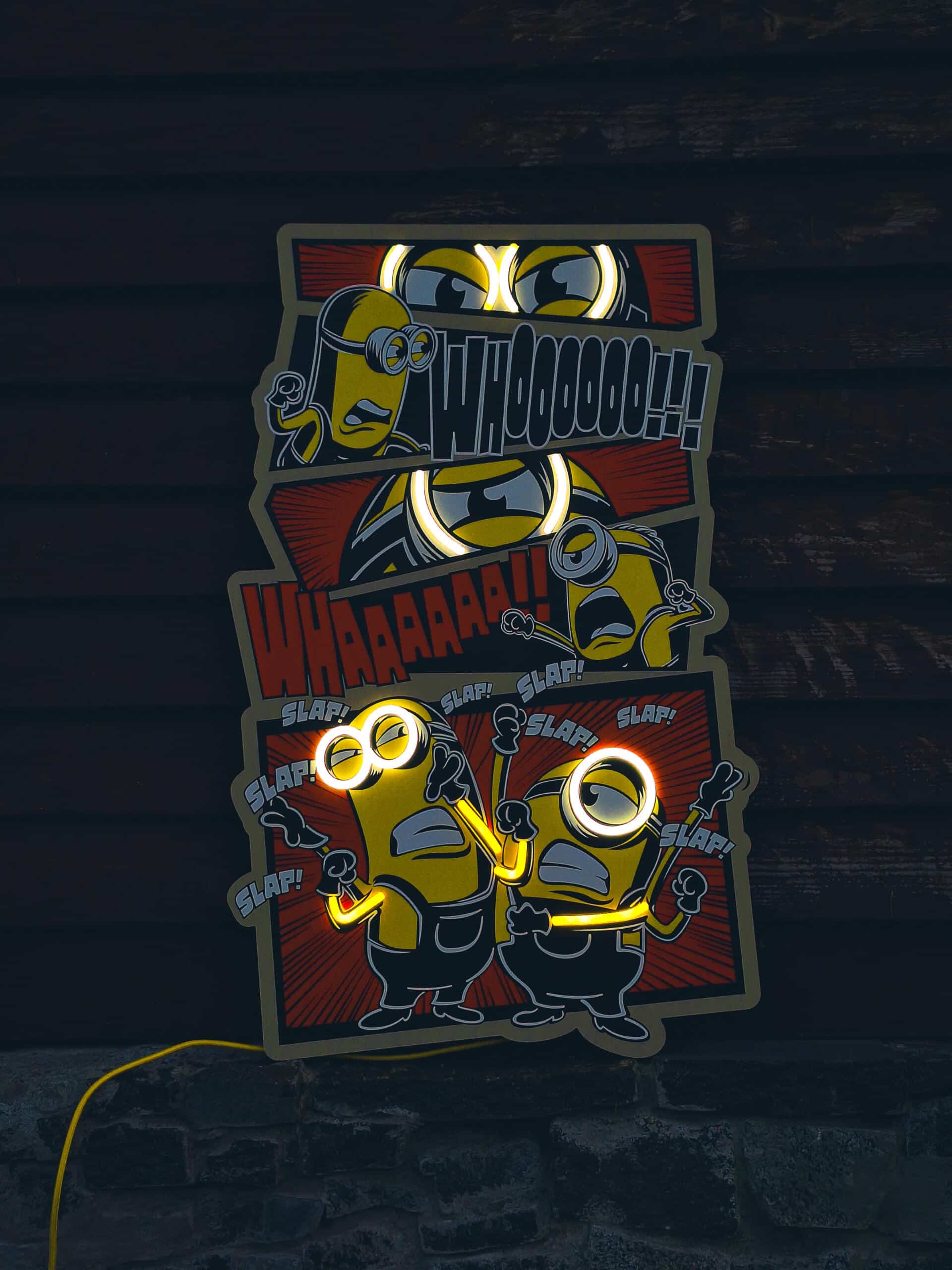 Exclusive Minions Comic LED Wall Art - Transform your space with this playful animated wall decor featuring the iconic yellow characters in comic strip style. Perfect for animation fans and kids' rooms!